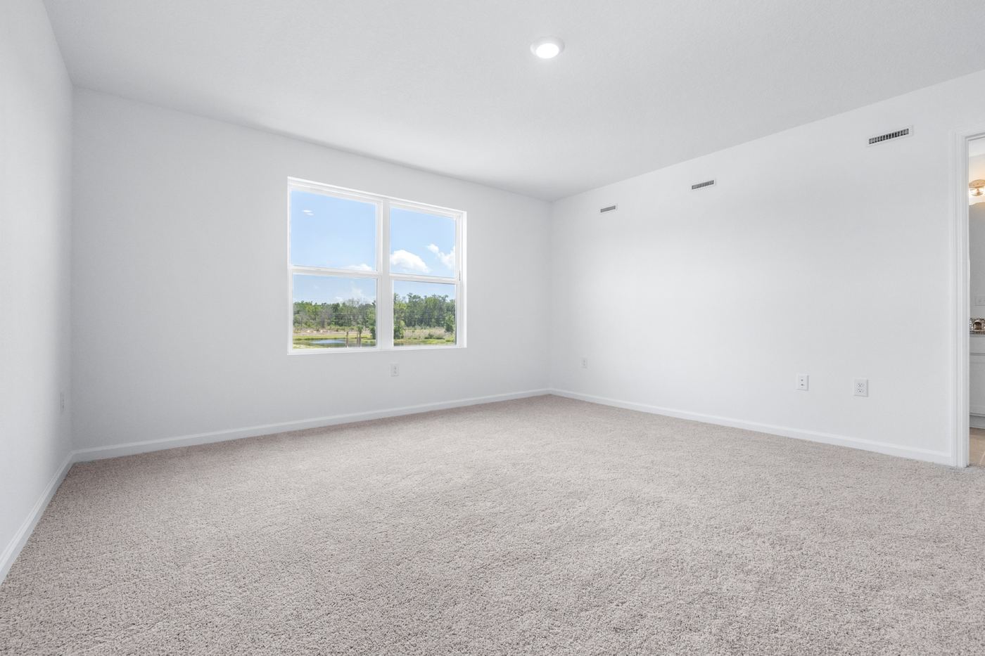 Primary bedroom with a large window